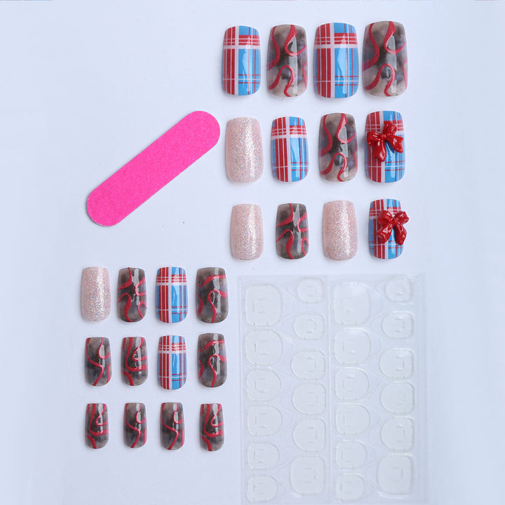 Artificial nails with festive gift design and glitter Bowlift