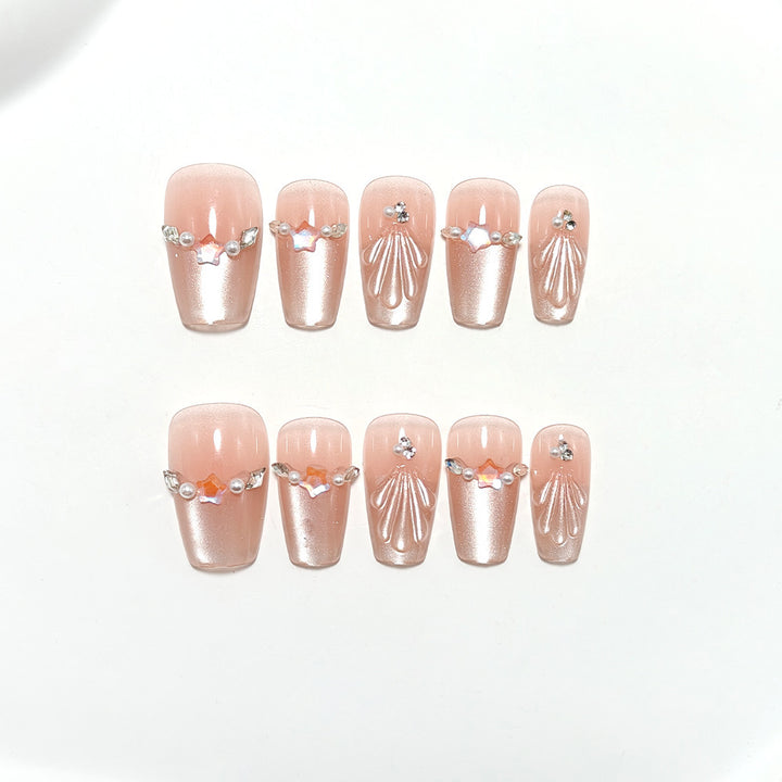 Elegant artificial nails with pearl and rhinestone embellishments Bowlift