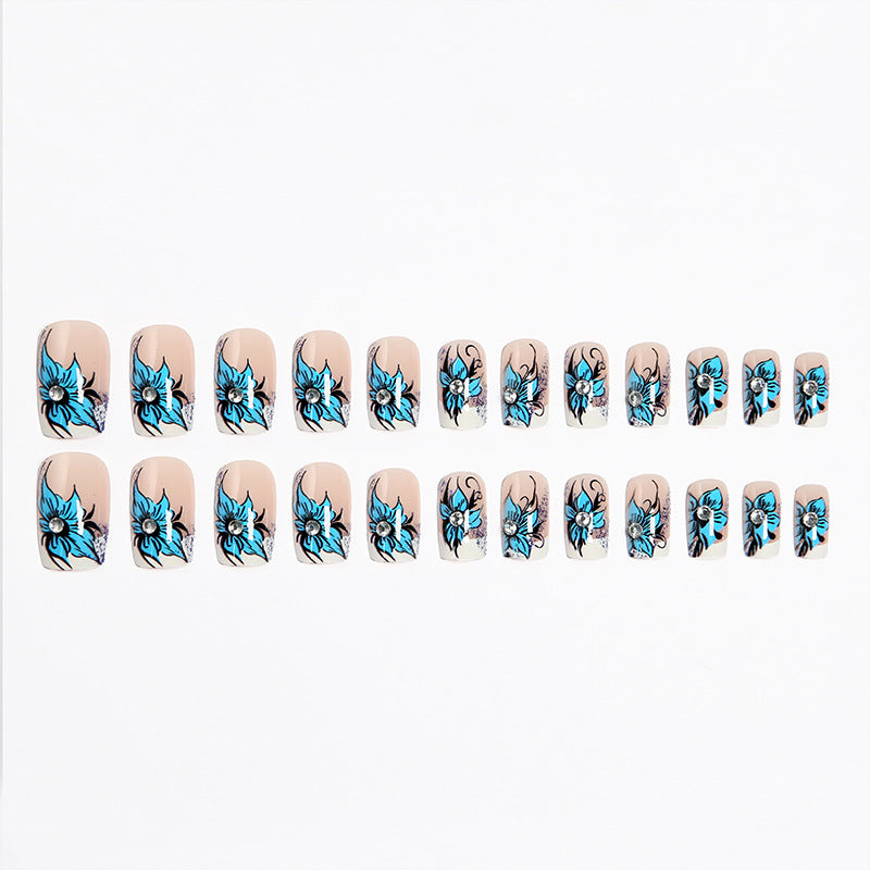 Artificial nail set with intricate floral designs and glitter elements Bowlift