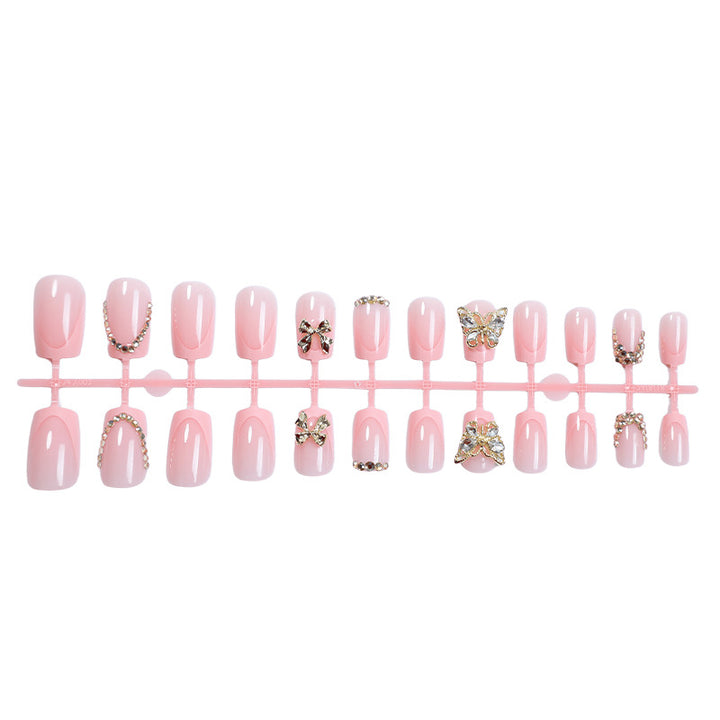 Glamorous artificial nail set with floral accents and glitter decorations Bowlift