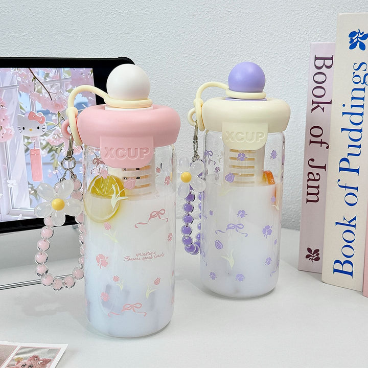 Women's bottle with integrated fruit infuser and Bowlift keychain