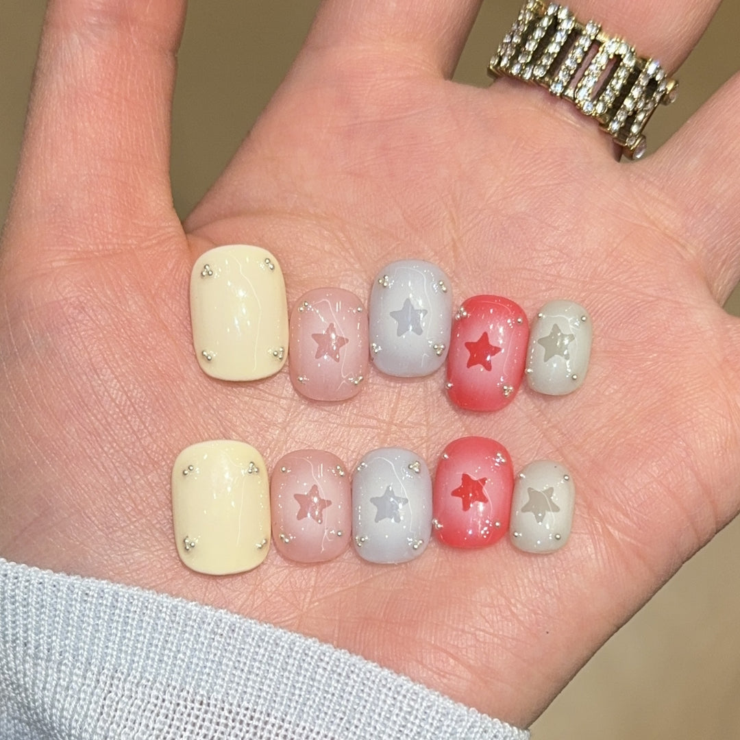 Artificial nails with sparkling star motifs Bowlift