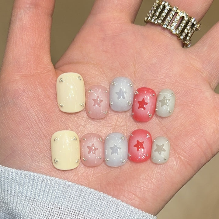 Artificial nails with sparkling star motifs Bowlift