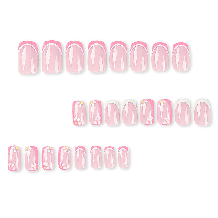 Artistic nail art with floral design and glitter accents Bowlift