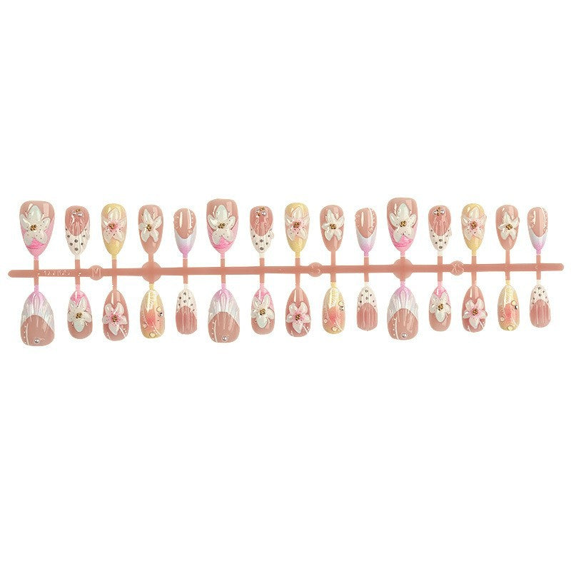 Nail art set with elegant floral design and glitter accents Bowlift