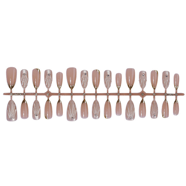 Artificial nail set with elegant gold tips and artistic decorations Bowlift