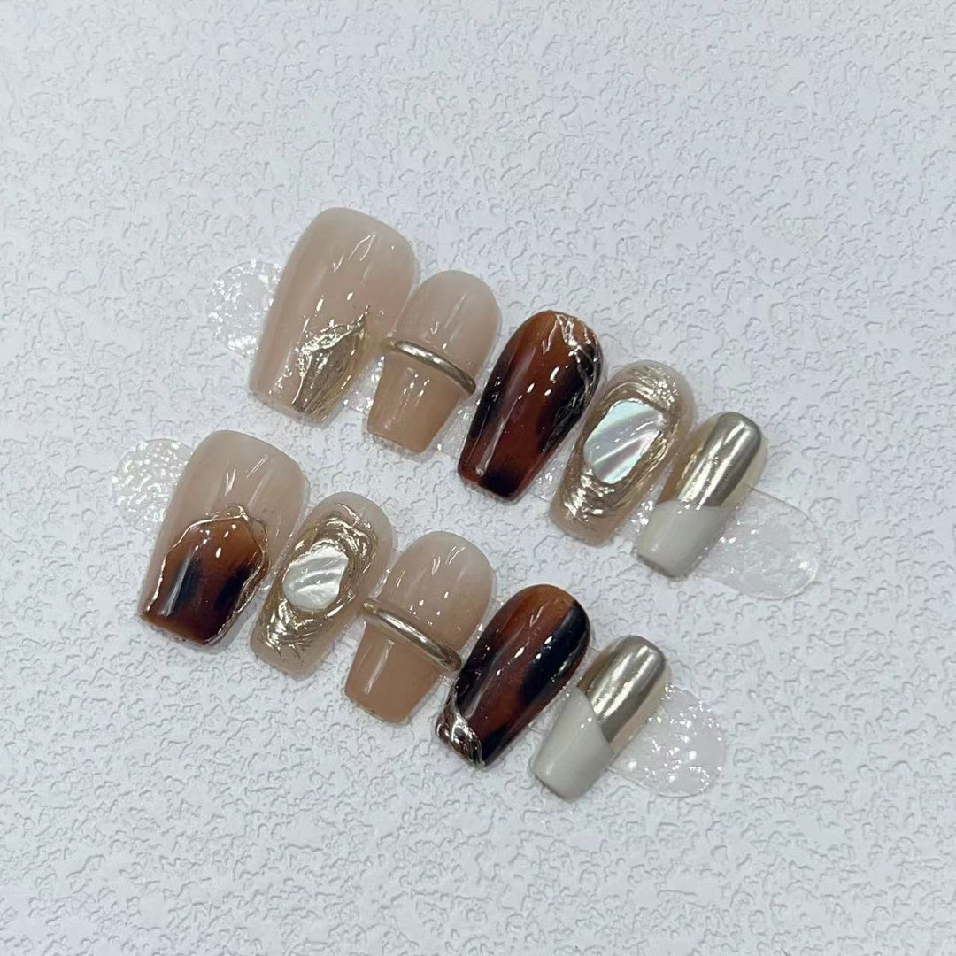 Elegant Nail Art Set with Unique Marble and Metallic Accents Bowlift
