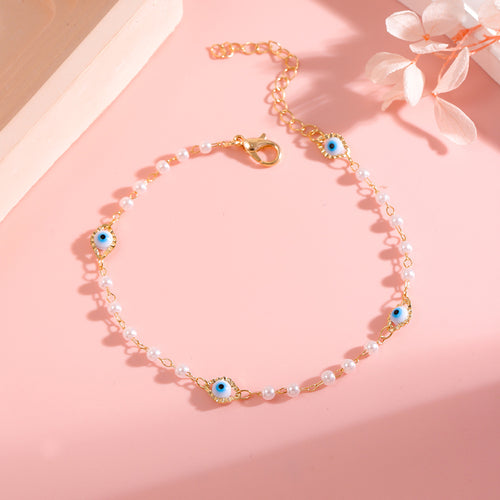Elegant Pearl and Eye Charm Necklace Bowlift