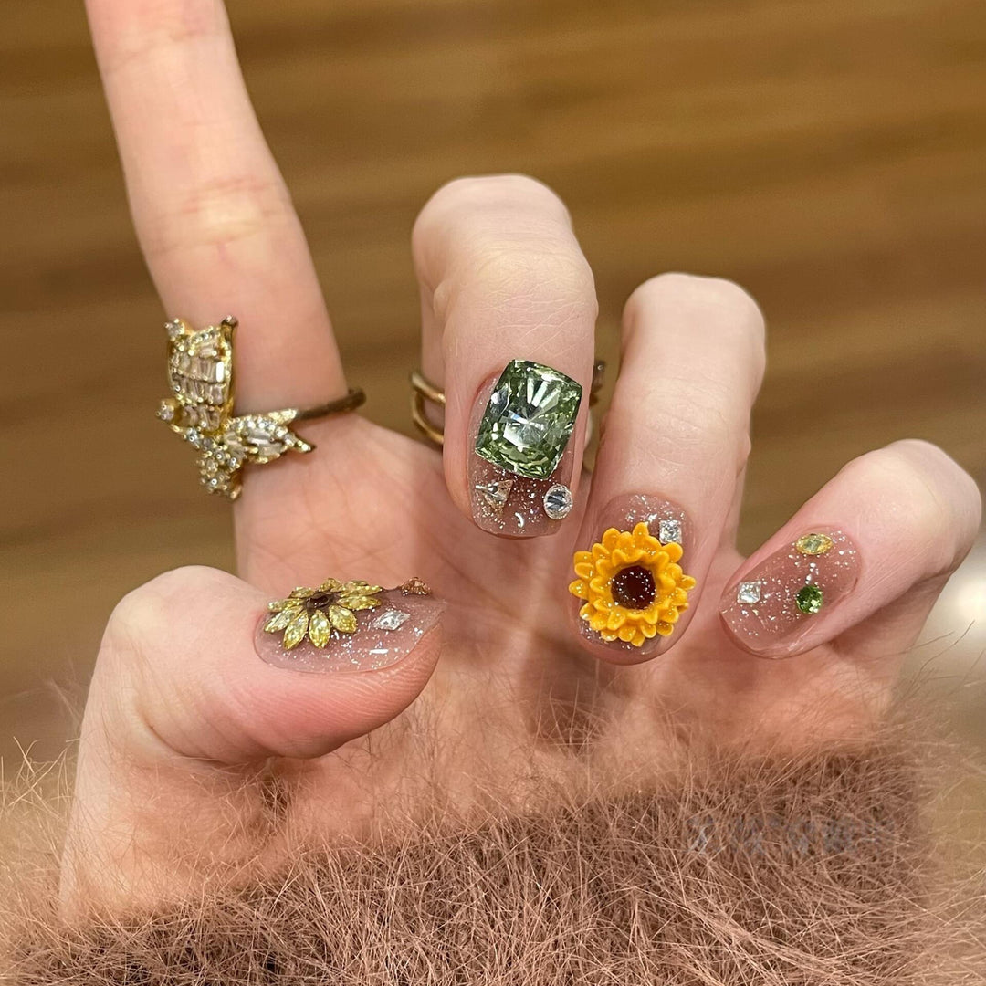 Artificial nails with sparkling appliqués and floral designs Bowlift