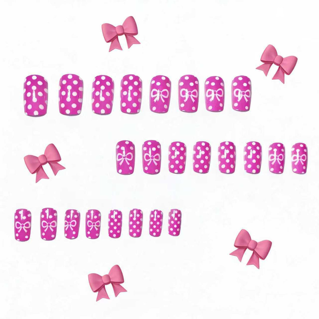 Artificial nails with romantic polka dot pattern and bow Bowlift