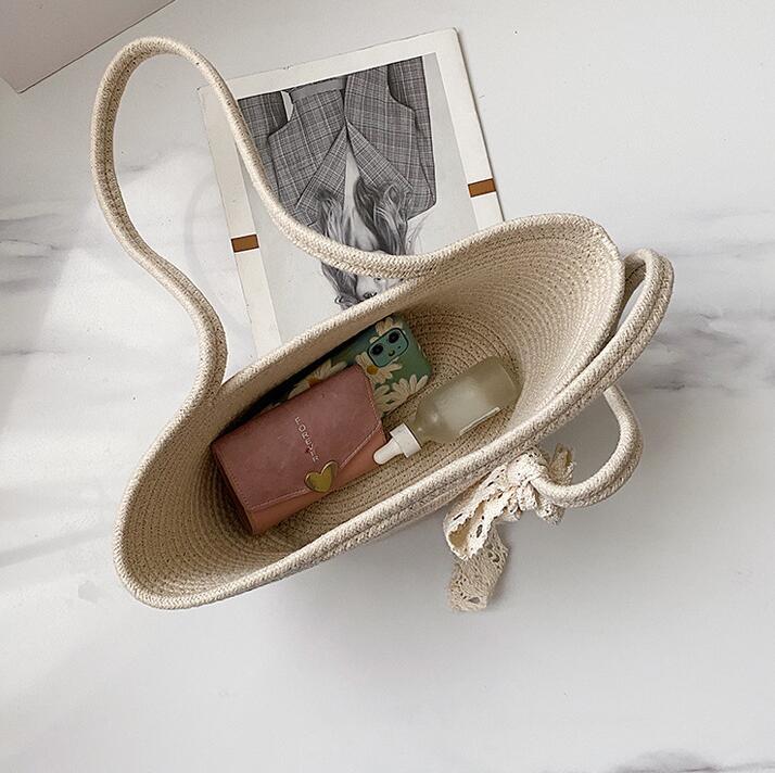 Elegant Bast Handbag with Lace Accent Bowlift