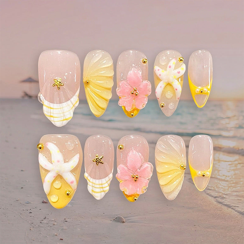 Artificial nail set with glamorous floral designs and creative glitter accents Bowlift
