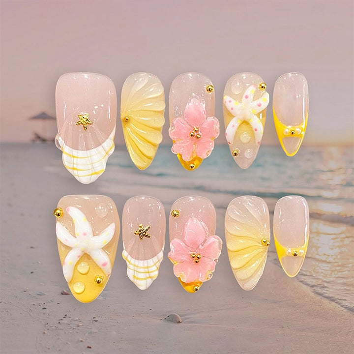 Artificial nail set with glamorous floral designs and creative glitter accents Bowlift