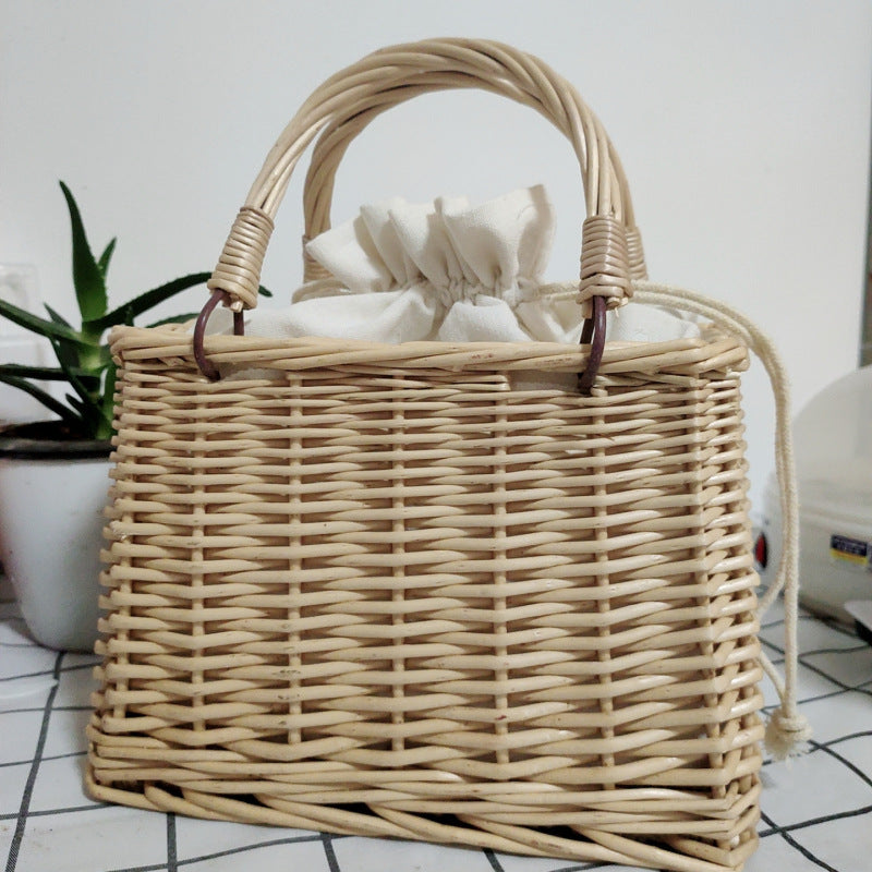 Women's handbag made of braided material with cotton drawstring closure Bowlift