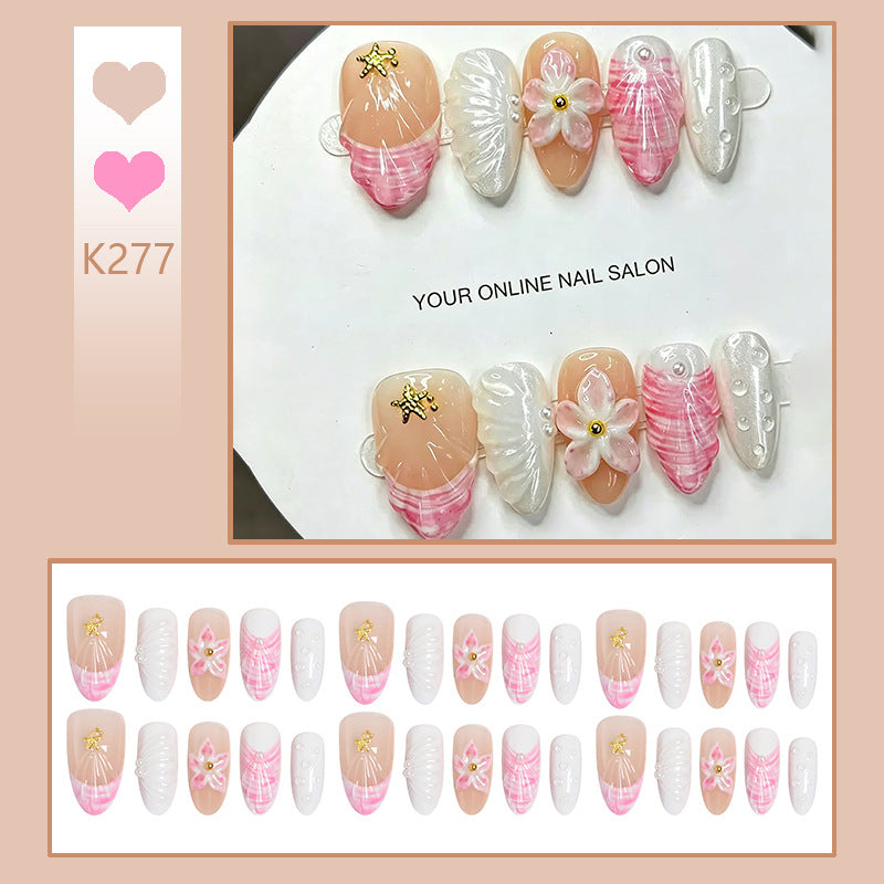 Artificial nail set with floral accents and glitter decorations Bowlift