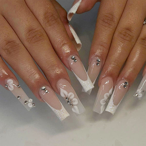 Glamorous stiletto artificial nails with floral details Bowlift