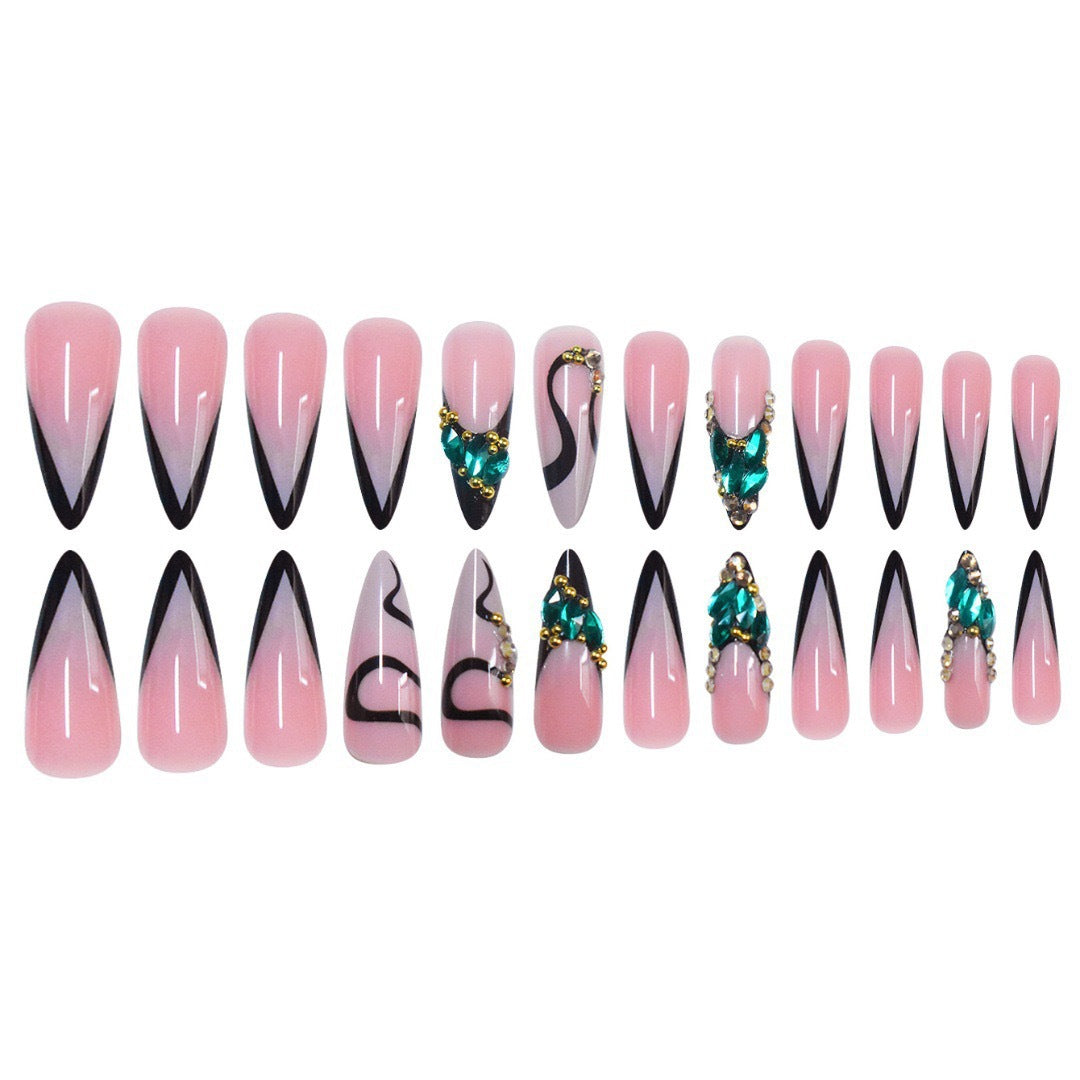 Elegant Stiletto Nail Enhancements with Gem Accents Bowlift