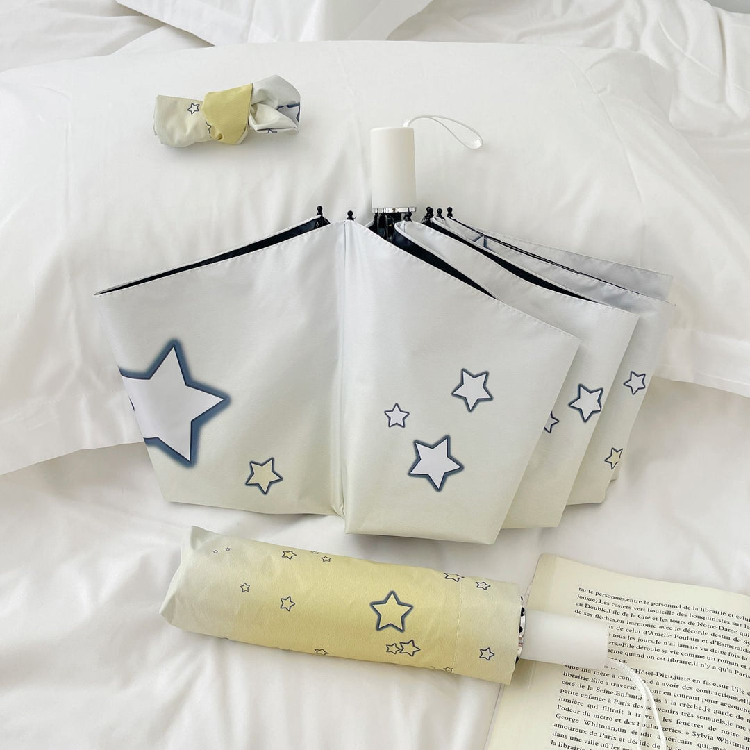 Women's compact folding umbrella with star pattern Bowlift