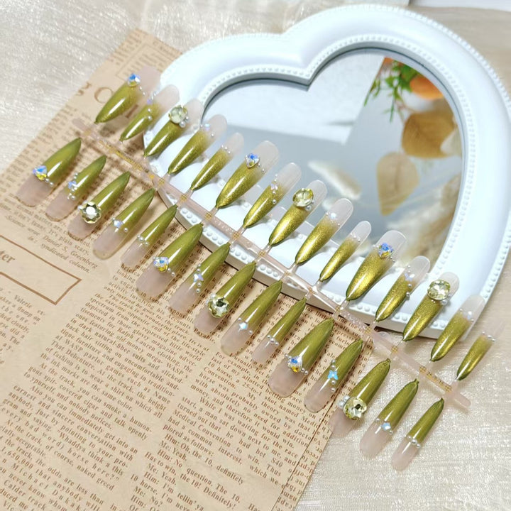 Artificial nail set with glamorous jewelry embellishments Bowlift