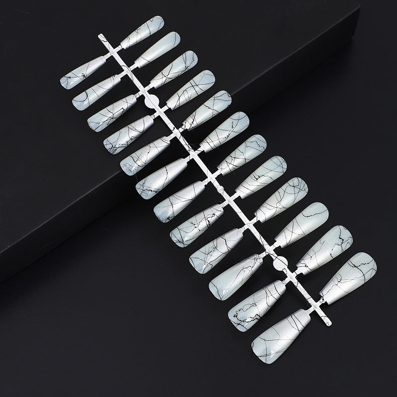 Artificial nails in modern ombre design with marbled accents Bowlift