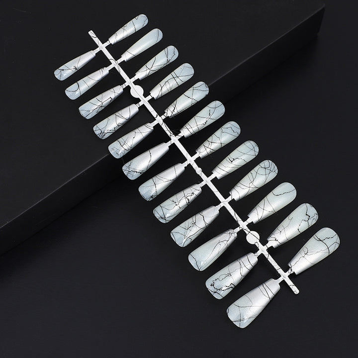 Artificial nails in modern ombre design with marbled accents Bowlift