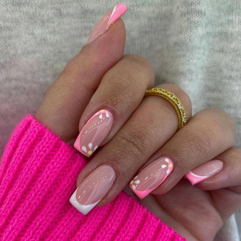 Artistic nail art with floral design and glitter accents Bowlift
