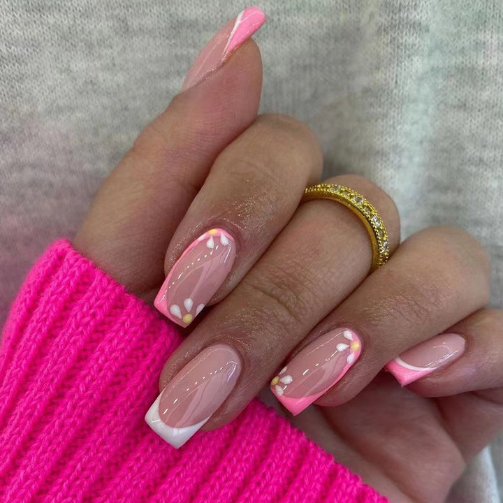 Artistic nail art with floral design and glitter accents Bowlift