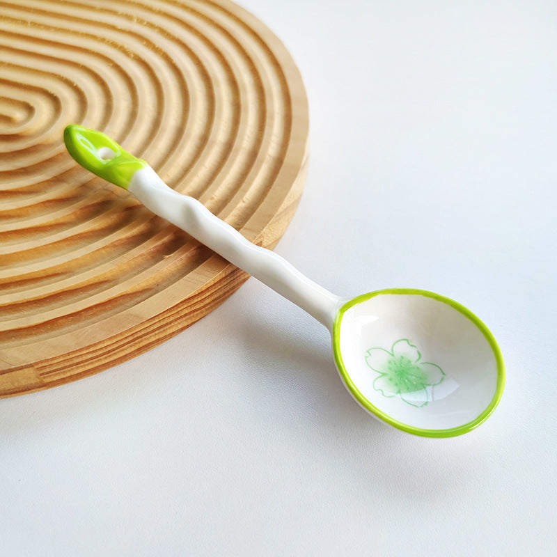 Ceramic soup spoon with lucky cat illustration and ergonomic long-handle Bowlift