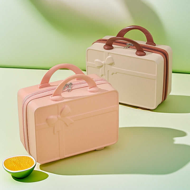 structured hard-shell cosmetic travel case with embossed bow and dual top handles Bowlift