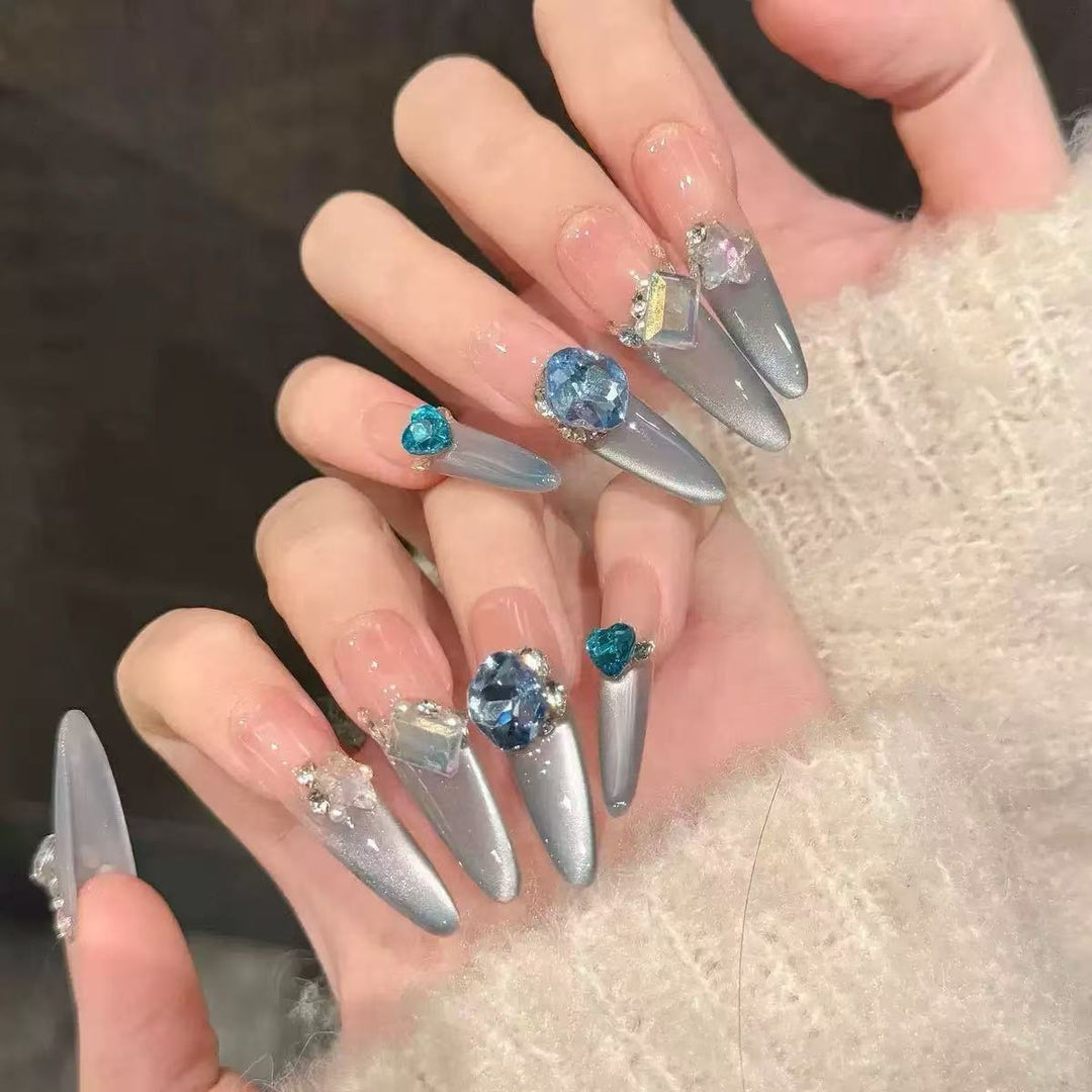 Acrylic nail set with elegant tips and glamorous rhinestone accents Bowlift