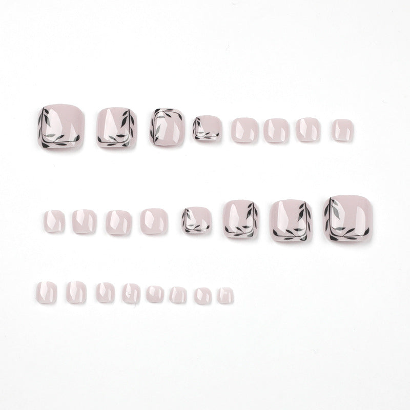 Artful toenail art with delicate leaf motifs Bowlift
