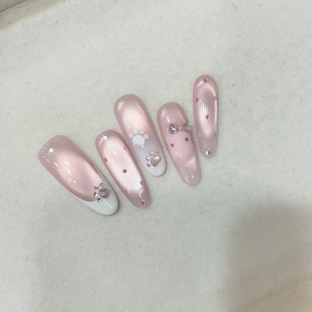 Artificial nail tips with playful penguin and paw print design Bowlift
