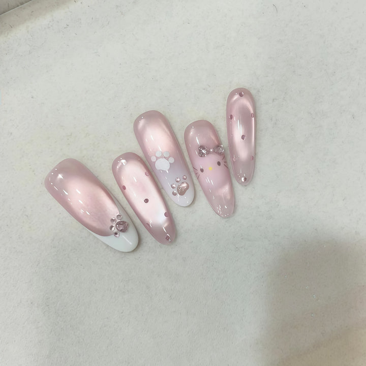 Artificial nail tips with playful penguin and paw print design Bowlift