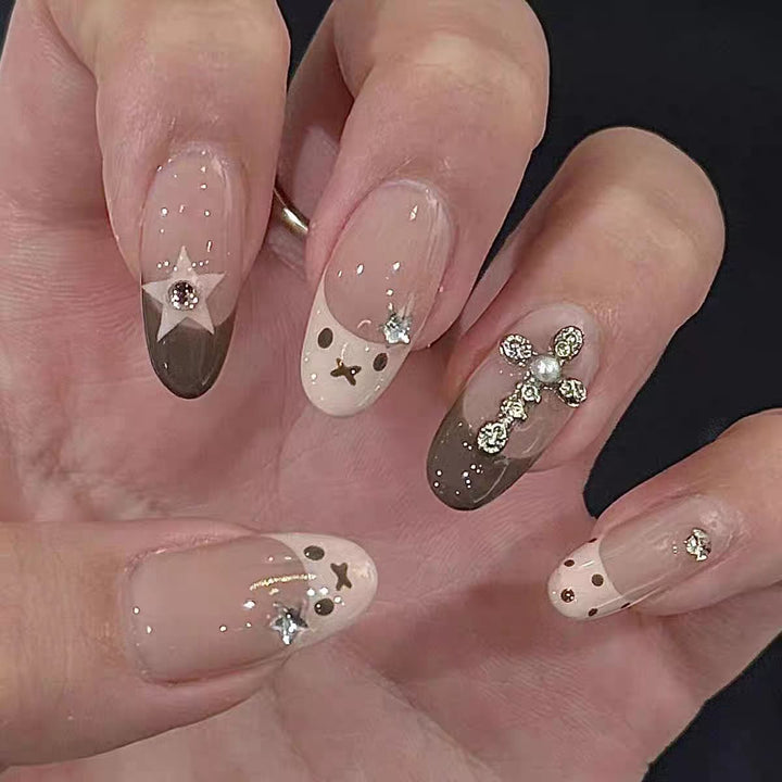 Artificial nails with creative design and sparkling accents Bowlift