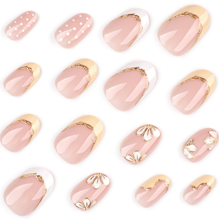 Artful Nail Extensions with Floral Design and Elegant Gold Accents Bowlift