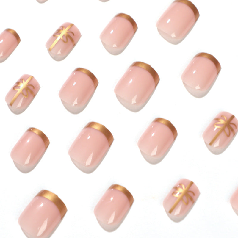 Elegant nail design with gold accents Bowlift