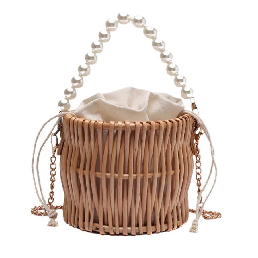 Women’s handbag with elegant pearl handle and braided design Bowlift