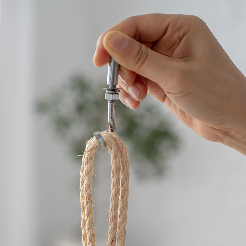Hanging chair made of braided natural material with comfortable cushions Bowlift