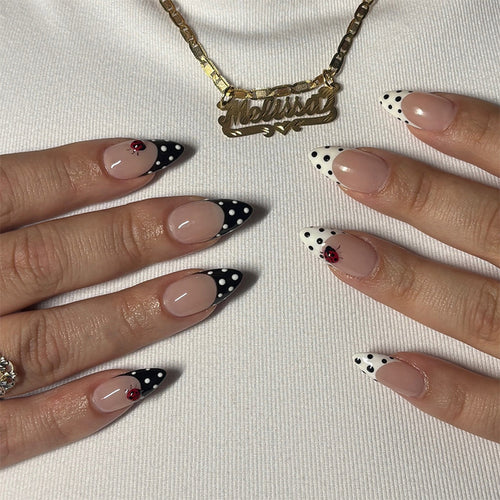 Acrylic nail set with polka-dotted accents and sparkling details Bowlift