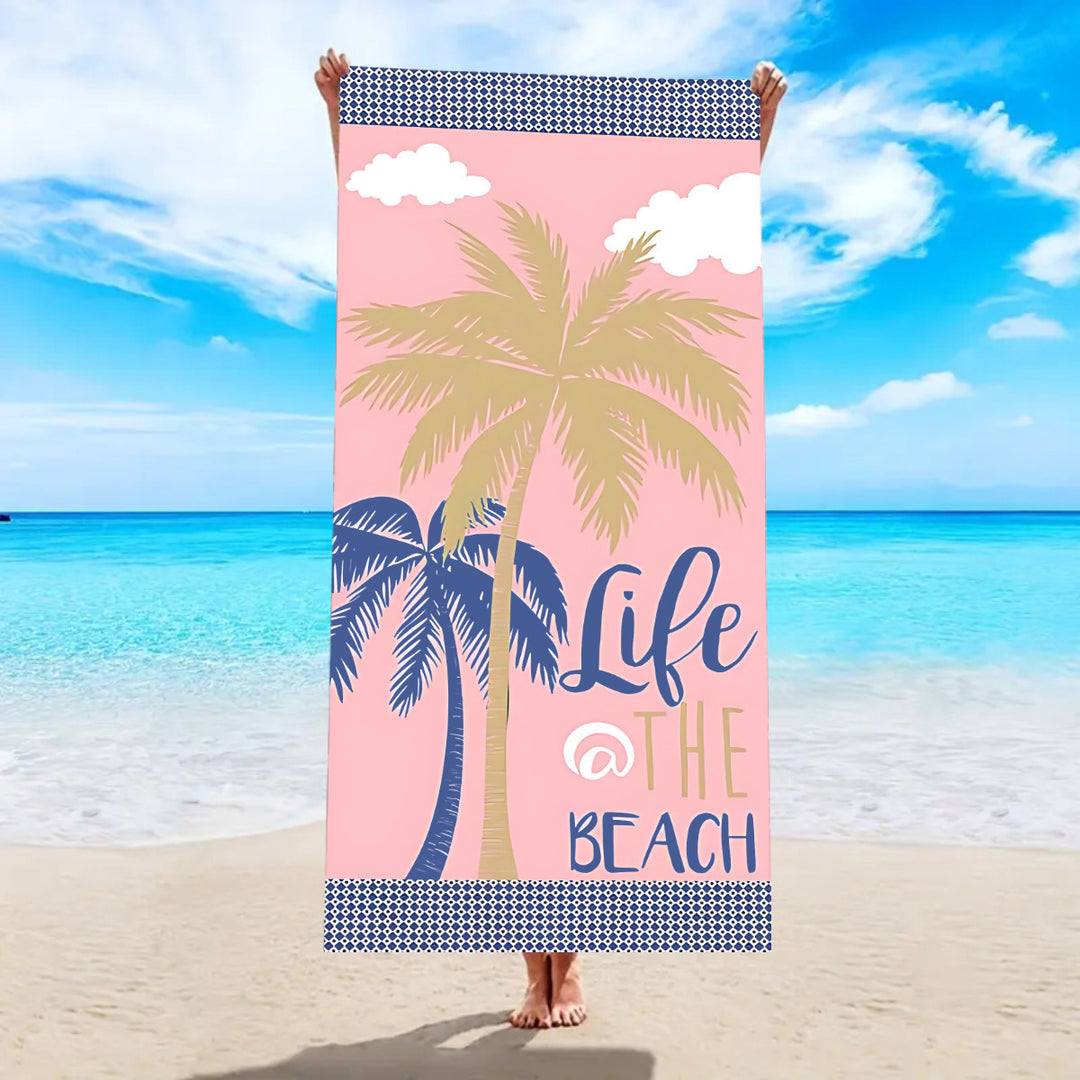 Beach towel with tropical palm leaf pattern Bowlift