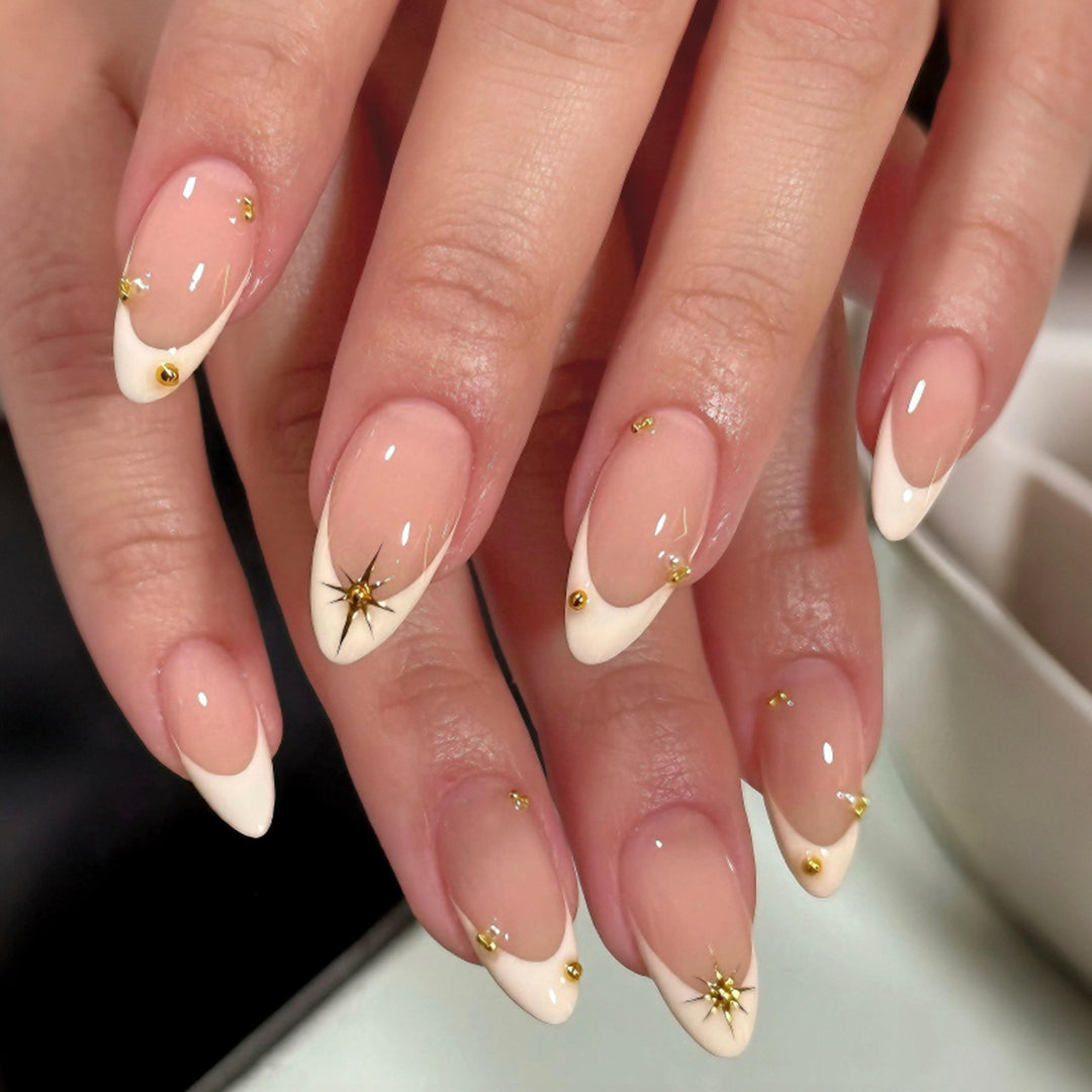 Glamorous stiletto nails with elegant star design Bowlift