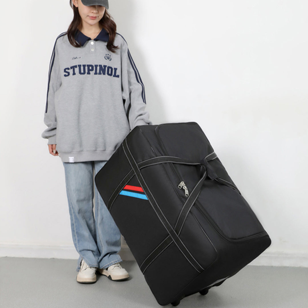 Spacious travel bag with lightweight wheels and reinforced carrying handle Bowlift