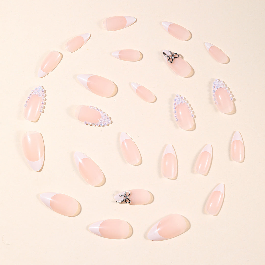 Elegant Pearl-Accentuated Stiletto Nail Art Bowlift