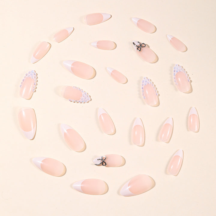 Elegant Pearl-Accentuated Stiletto Nail Art Bowlift