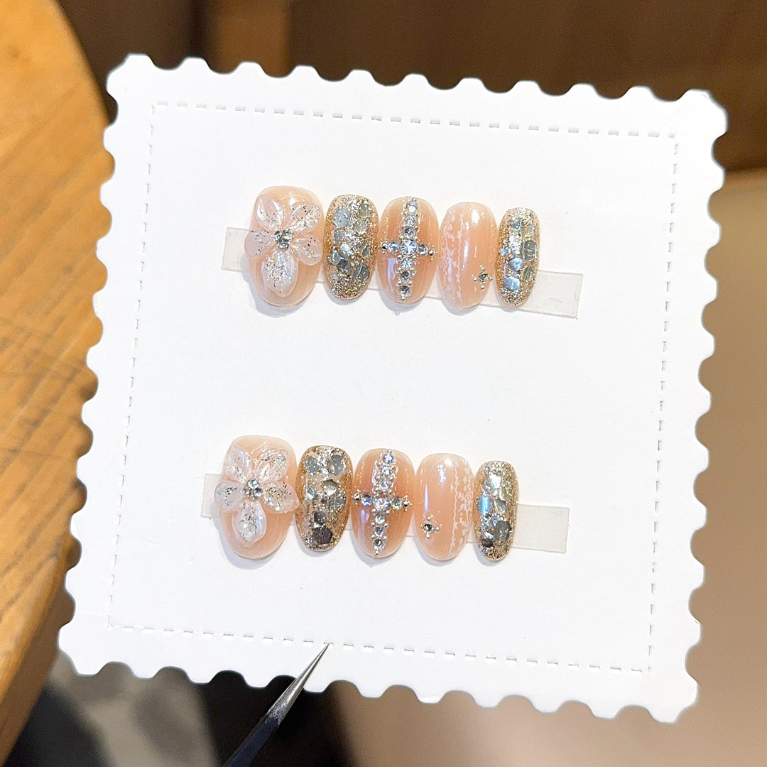 Glamorous artificial nails with floral and glittering accents Bowlift