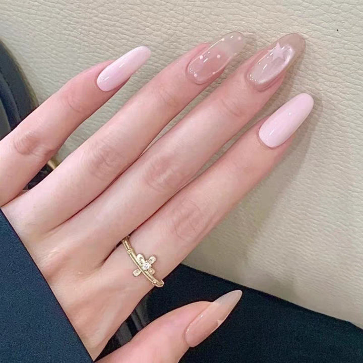 Artistic Press-On Nail Design with Floral and Gemstone Accents Bowlift