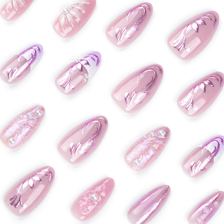 Artificial nail extensions with delicate floral designs and glitter accents Bowlift