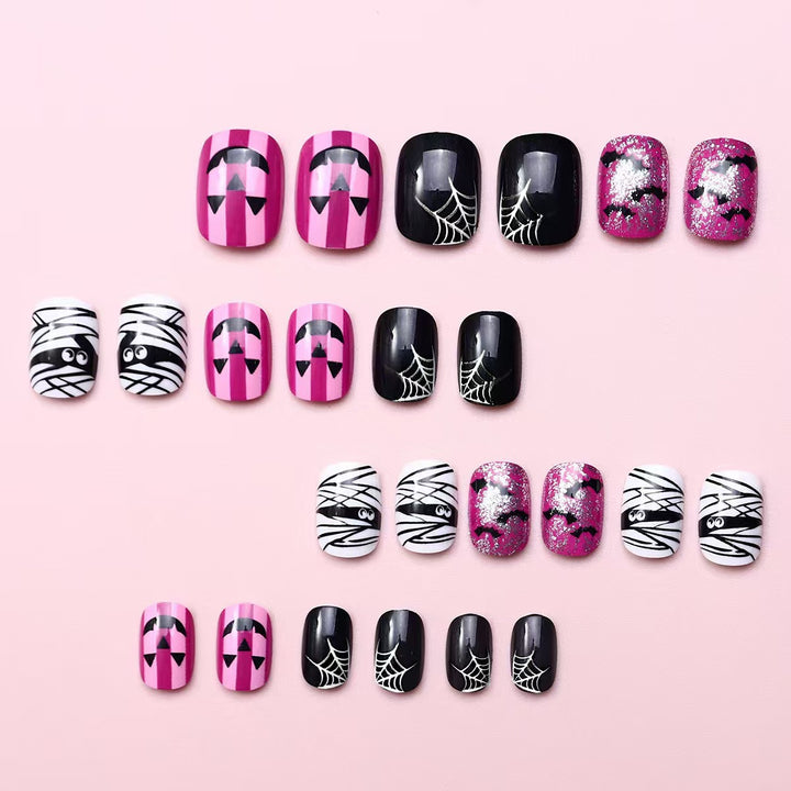 Creative nail art set with Halloween motifs and glitter accents Bowlift