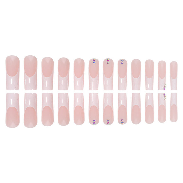 Nail set with elegant French tips and sparkling rhinestone embellishments Bowlift