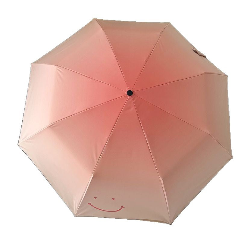 Women's foldable umbrella with playful design and handy wooden handle Bowlift